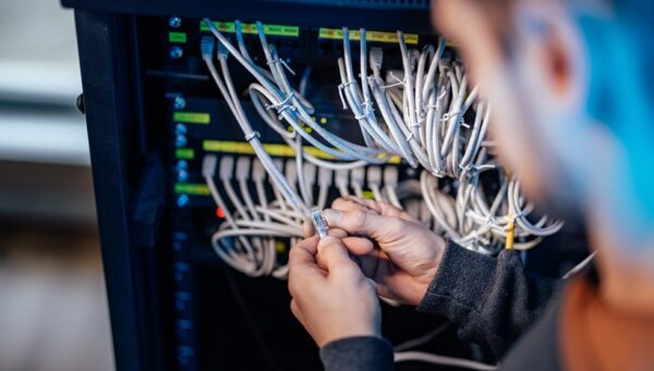 Setting network up, close-up. Connection procedure. Checking ethernet jack.