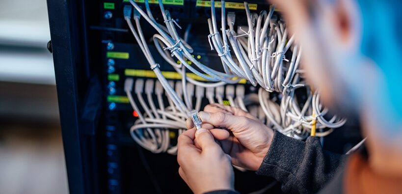 Setting network up, close-up. Connection procedure. Checking ethernet jack.